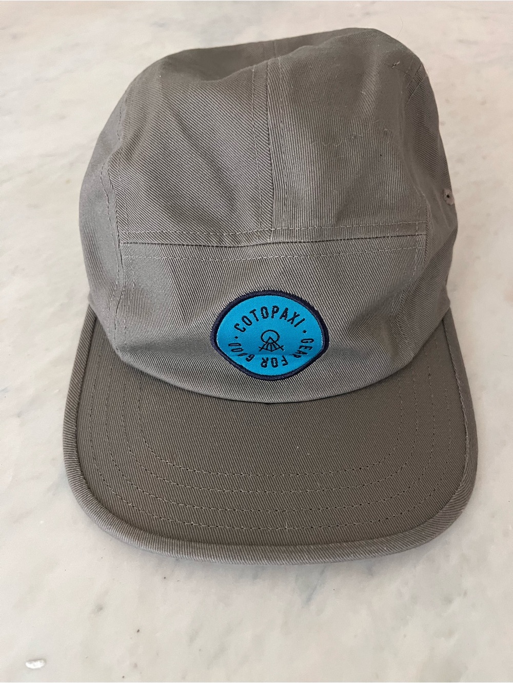 Cotopaxi 5 panel hat Gray Five-Panel Cap with Blue Patch